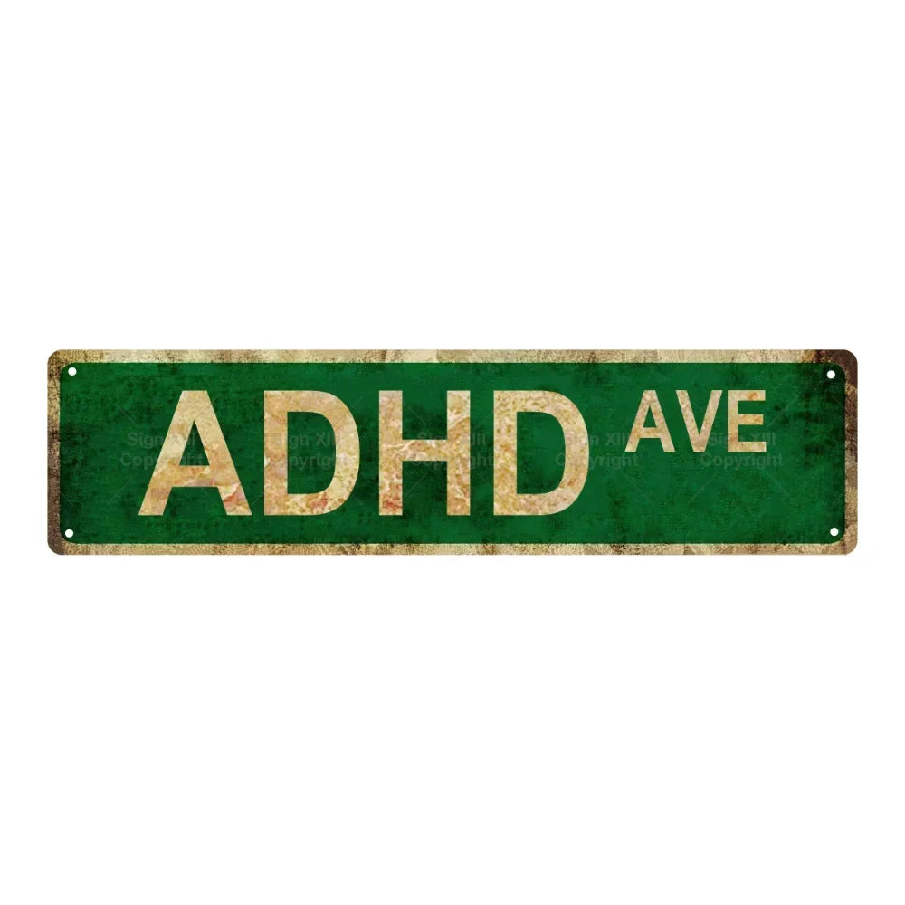 A weathered green metal tin sign with the text ADHD AVE.