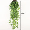 A long, cascading garland of artificial green ivy vine with a 90cm length for indoor and outdoor decoration.