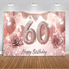 A pink and gold glitter balloon backdrop for a 60th birthday photo booth featuring balloons and roses.