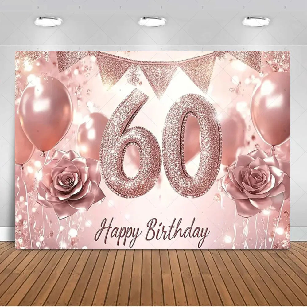 A pink and gold glitter balloon backdrop for a 60th birthday photo booth featuring balloons and roses.