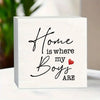 A white wooden sign with black script that reads Home is where my Boys are and a small red heart.