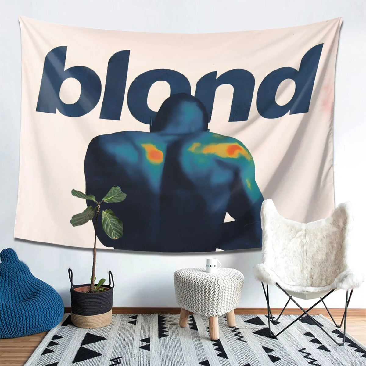A dark silhouette of a person against a light background on a tapestry featuring the word blond.