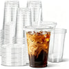 A stack of clear disposable plastic cups with lids and a glass of iced coffee