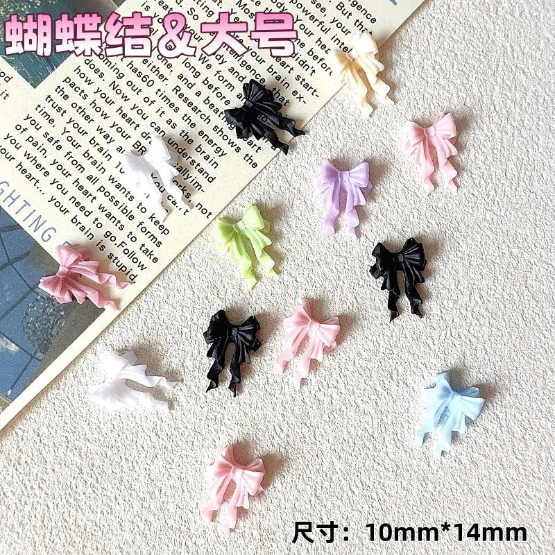Colección de 50 adornos de uñas en forma de tortuga miniatura de colores: rosa, morado, verde y negro.