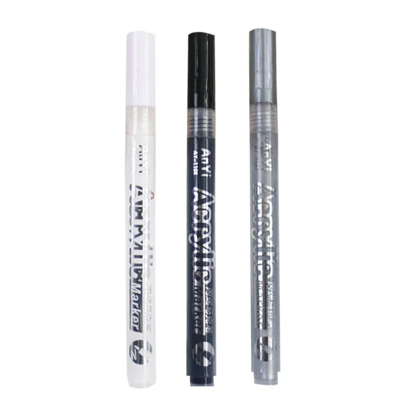 Three acrylic paint pens in clear tubes showing the tips of the pens.
