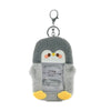 A gray penguin keychain featuring a cute face and yellow feet.