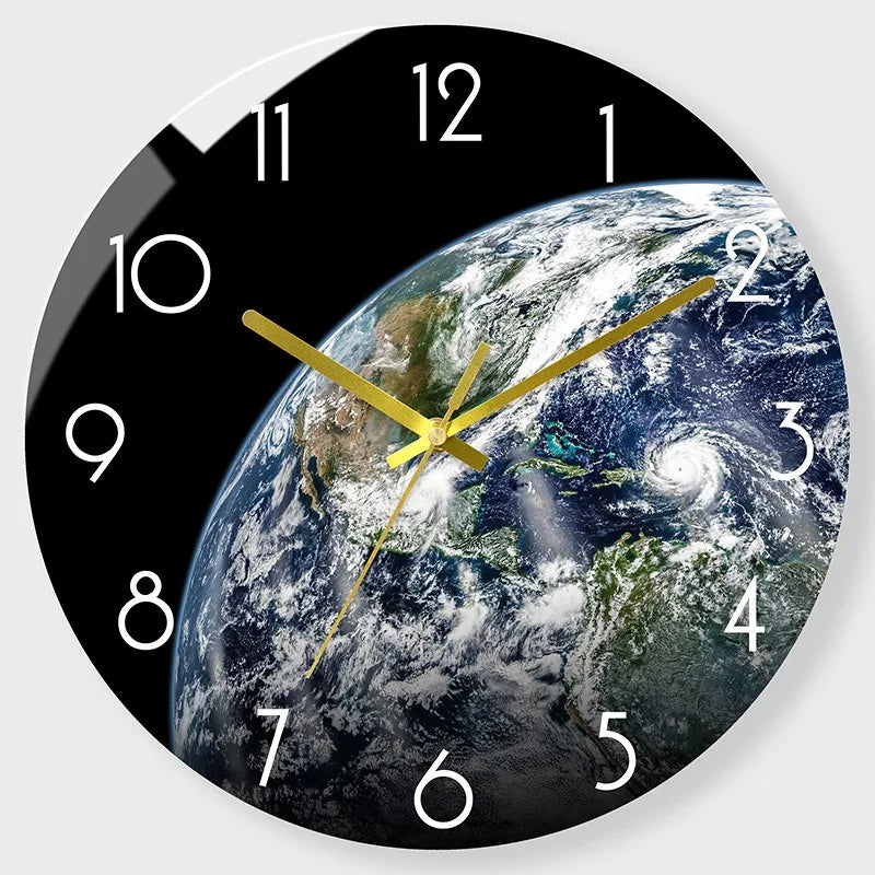 A black round wall clock face showing a view of Earth with the hands pointing to approximately 1:30.