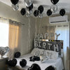 Silver alphabet and heart balloon set hanging above a bed for party decorations