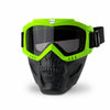 A pair of neon green full face skull riding goggles with a black strap and lens.