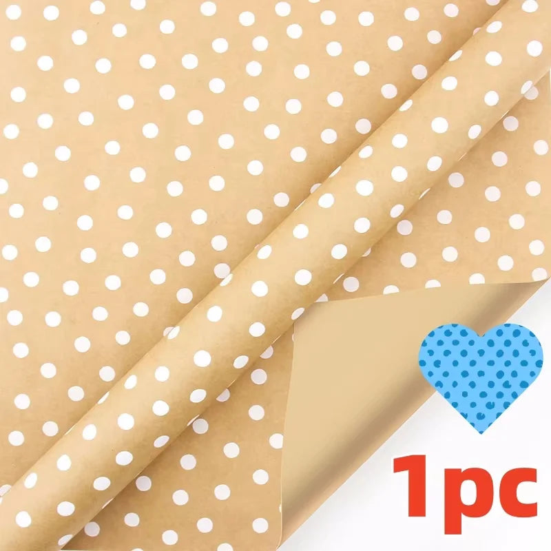 A roll of festive snowflake Christmas wrapping paper in a light beige color with white polka dots.