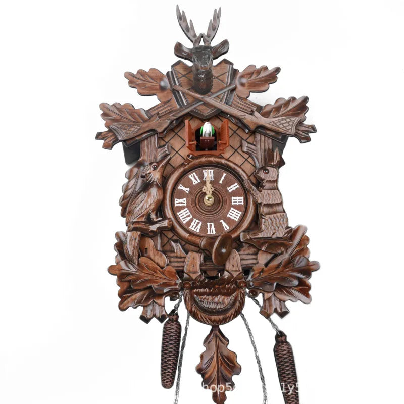 A vintage wooden cuckoo clock featuring intricate carvings and a round clock face.