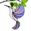 A colorful acrylic hummingbird suncatcher with iridescent pink and blue wings hanging from a branch.