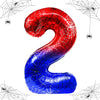 A foil balloon shaped like the number 2, featuring a spider web design in red and blue colors.