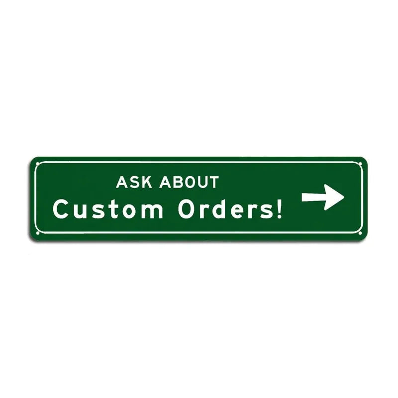 Green rectangular sign with white text that reads ASK ABOUT Custom Orders!