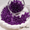 A clear glass bowl filled with purple round spacer beads for jewelry making, displayed on a white dish.