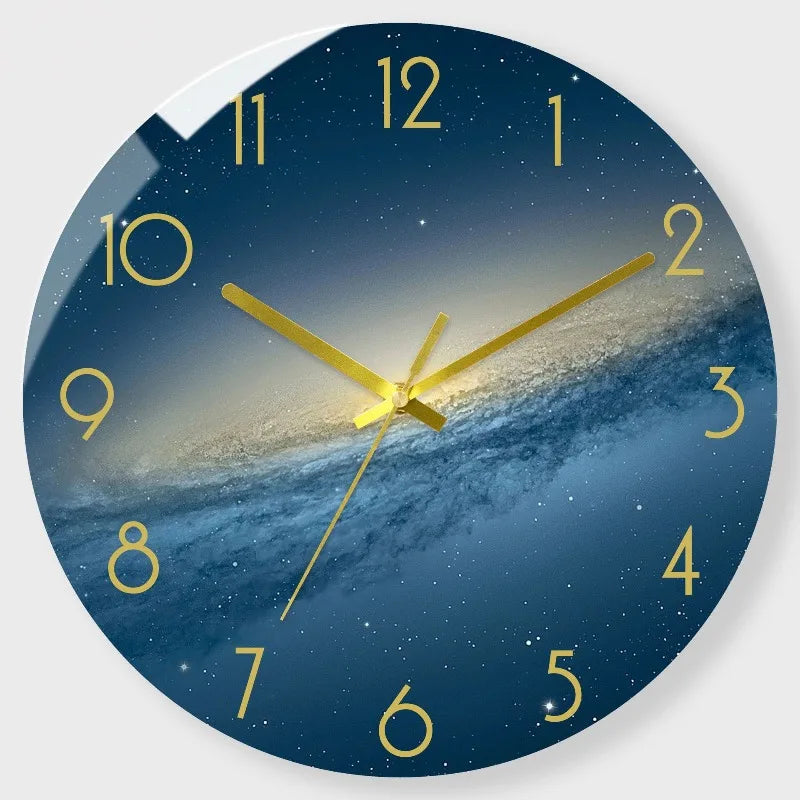 A round wall clock face showing a night sky and stars with golden hands.