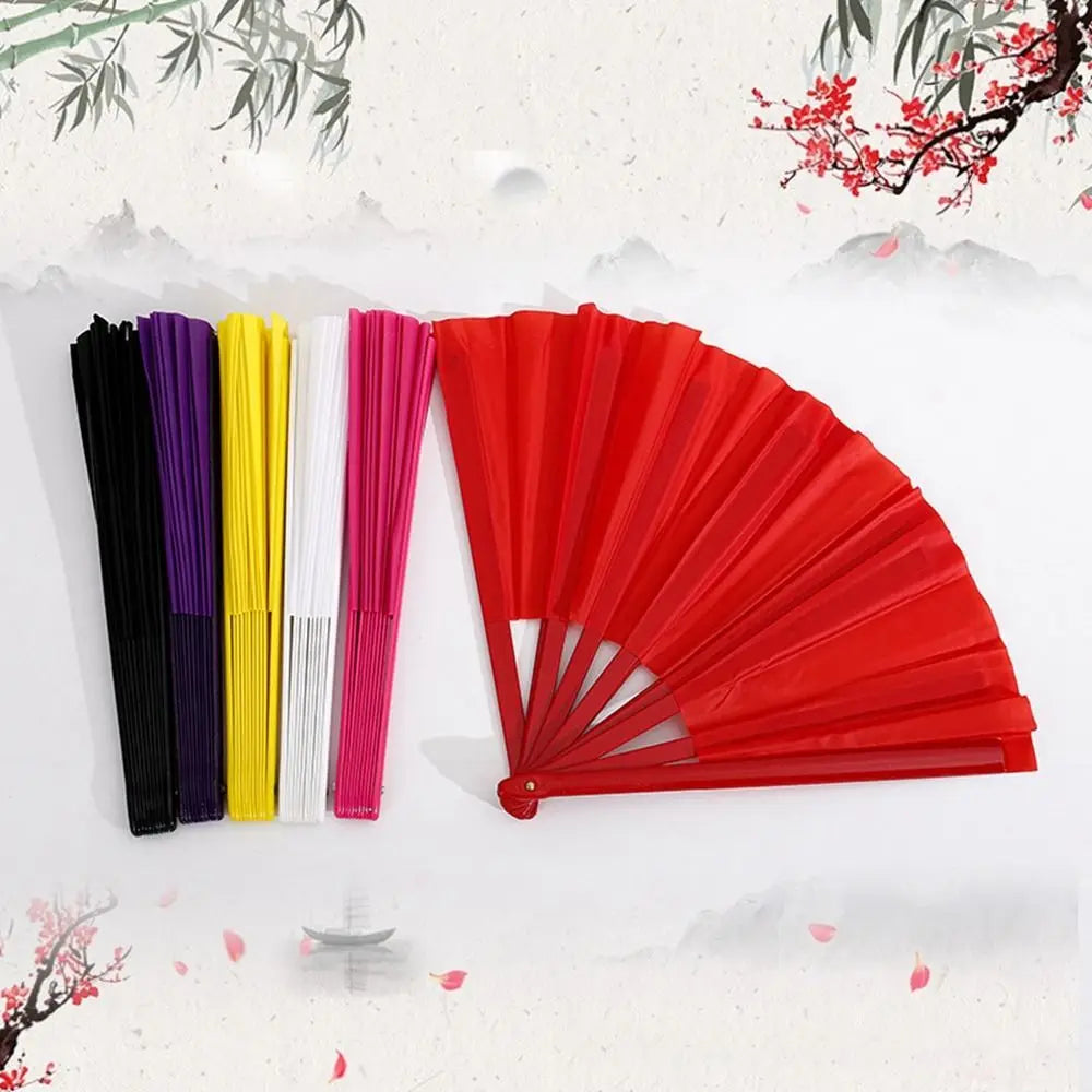 A display of various colored Tai Chi performance fans, including black, purple, yellow, white, and pink, arranged horizontall
