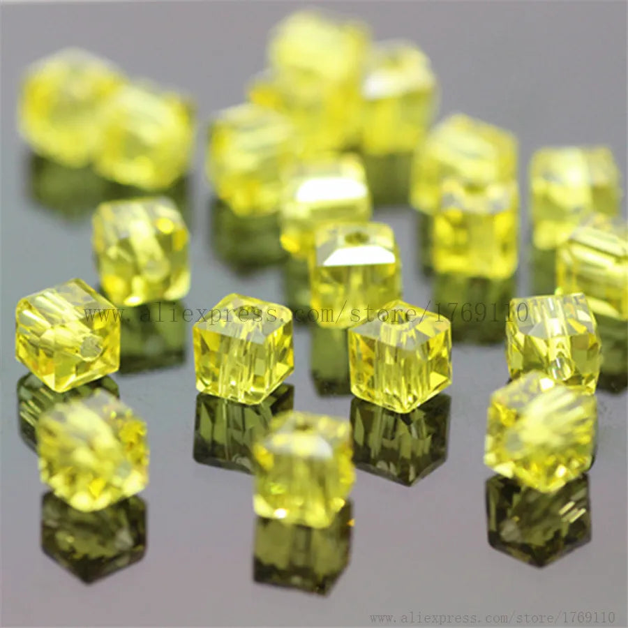 A collection of square cut yellow glass crystal beads for jewelry making
