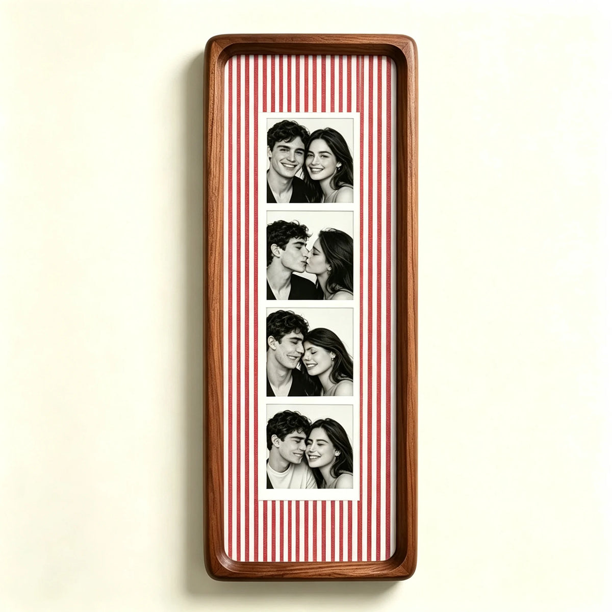 A wooden photo strip frame with a red and white striped background displaying several portrait photos of a couple.