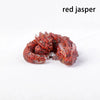 A reddish-brown jasper crystal figurine shaped like a dragon, used for Feng Shui decor.
