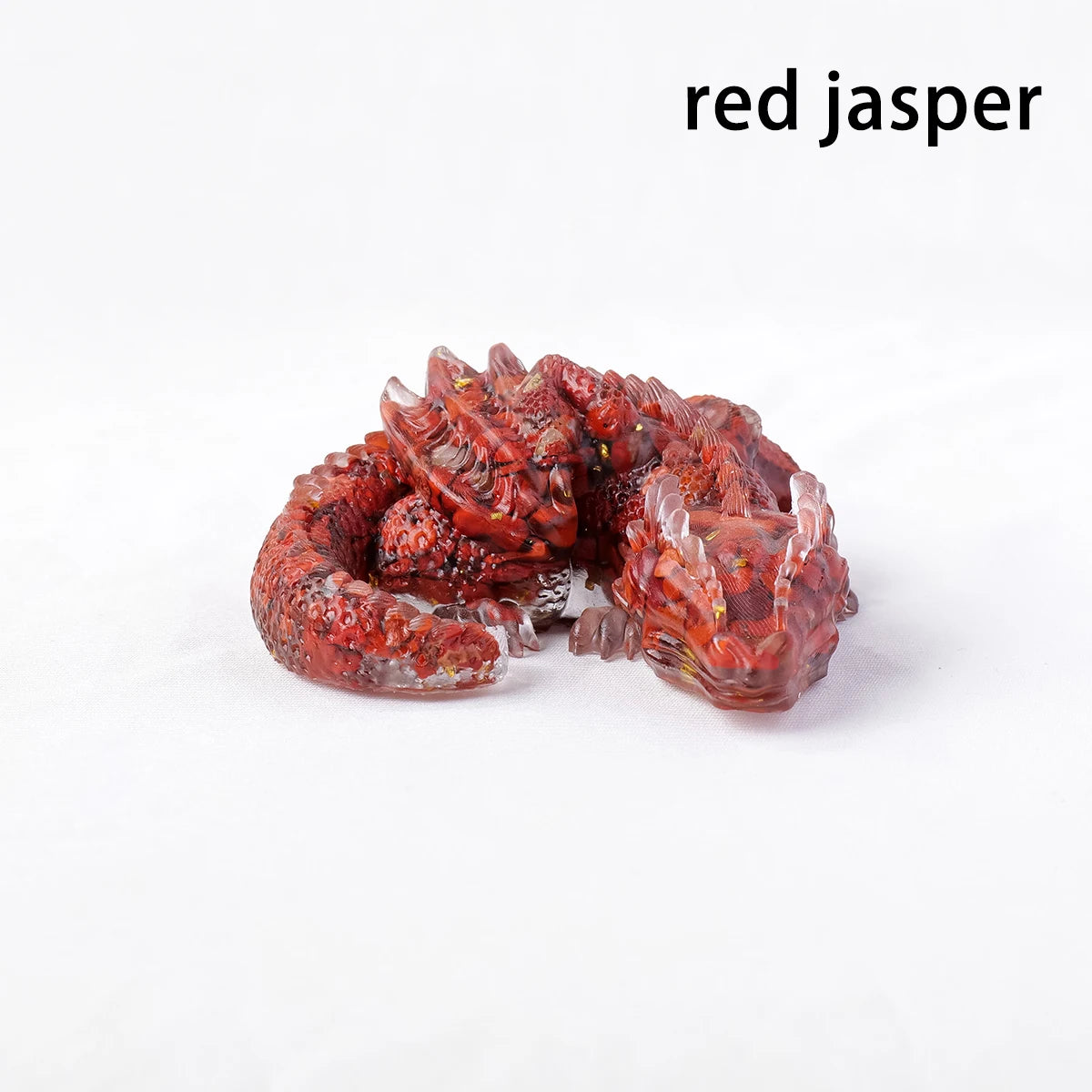 A reddish-brown jasper crystal figurine shaped like a dragon, used for Feng Shui decor.