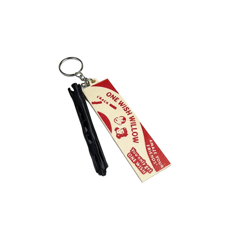 A black stick with a hanging loop and a yellow tag that reads One Wish Willow