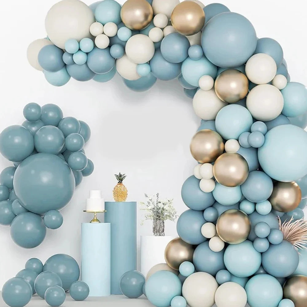 A blue and gold balloon garland arch featuring various sized balloons arranged in an arch shape.