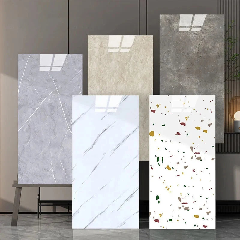 A display of various marble wall decals in different shades of gray and white on a wooden stand.