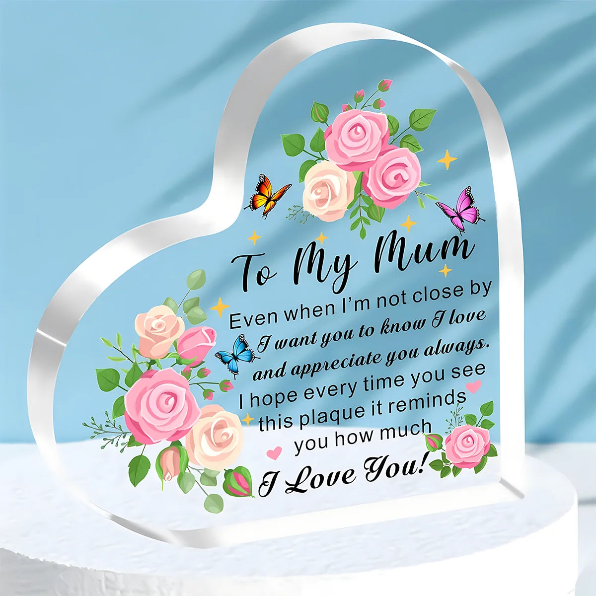 A clear acrylic heart plaque engraved with a floral design and the message To My Mum Even when I'm not close by I want you to