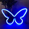 A glowing blue neon sign shaped like a butterfly displayed against a dark background.