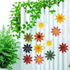 A set of metal flower wall decorations featuring various colorful, cutout flowers displayed against a white vertical slat bac