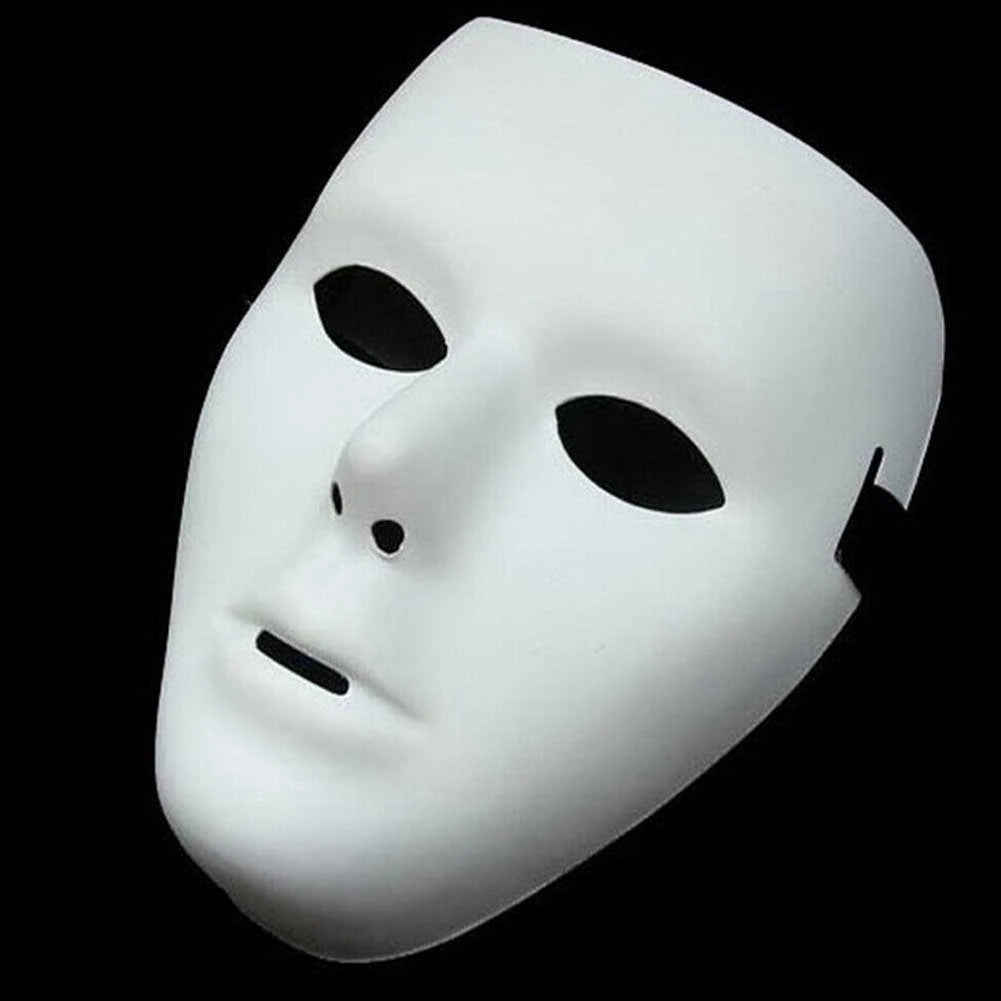 A white performance mask with a smooth, featureless face is shown against a black background.