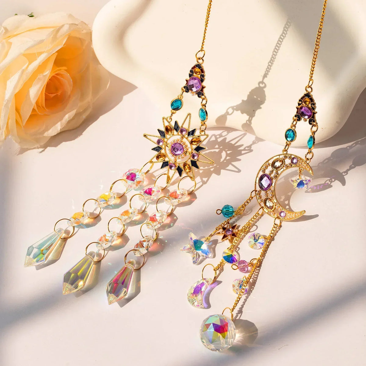 Gold crystal rhinestone sun and moon catchers hanging on a delicate chain