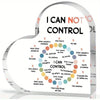 A heart-shaped acrylic sign displaying the phrase I CAN NOT CONTROL and I CAN CONTROL with various examples.