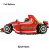 A red and yellow foil balloon shaped like a race car for birthday party decorations.
