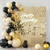 A gold and black balloon arrangement against a shimmering gold sequin wall backdrop with 'Happy Birthday' text.