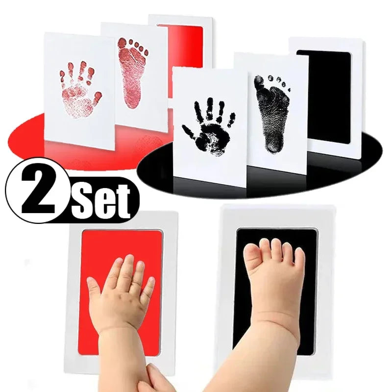 A set of handprint and footprint ink pads for babies, showing various prints on white cards and a baby's hand and foot.