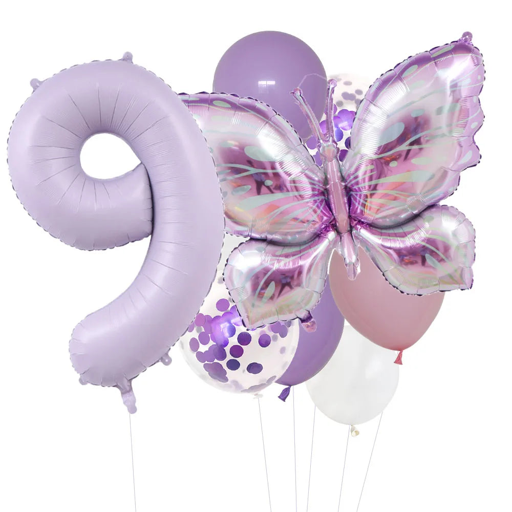 A set of purple foil balloons shaped like the number nine and a butterfly