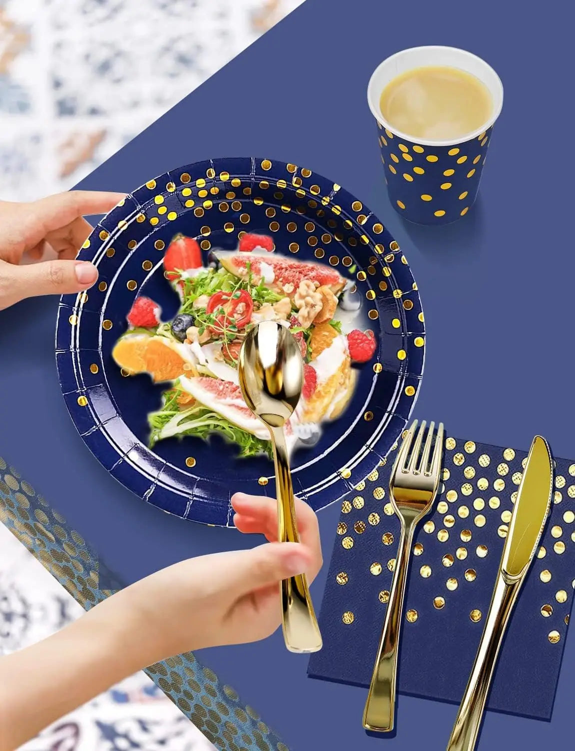 A hand is holding a gold spoon above a blue plate filled with fruit and salad, set against a dark blue background.