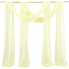 A set of two sheer yellow chiffon fabric panels draped for a wedding arch backdrop.