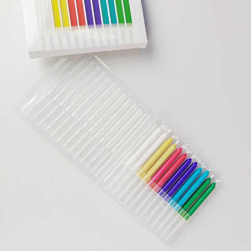 A clear plastic container filled with colorful birthday candles for party cake decorations.