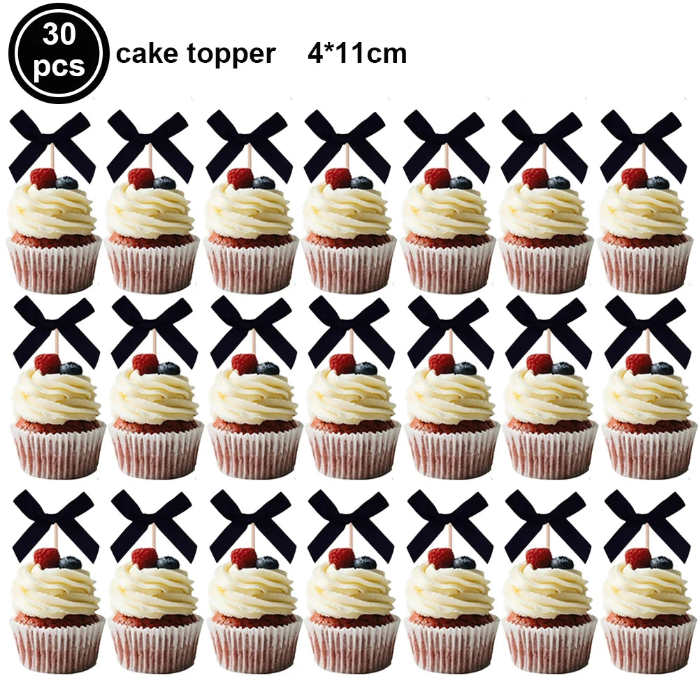 A set of 30 pink bow cupcake toppers measuring 4x11cm.