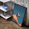 A framed canvas wall art poster depicting a Lockheed Martin F-22 Raptor jet flying through clouds.