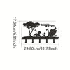 Decorative metal key hooks for wall organization featuring a silhouette of a tree and figures.