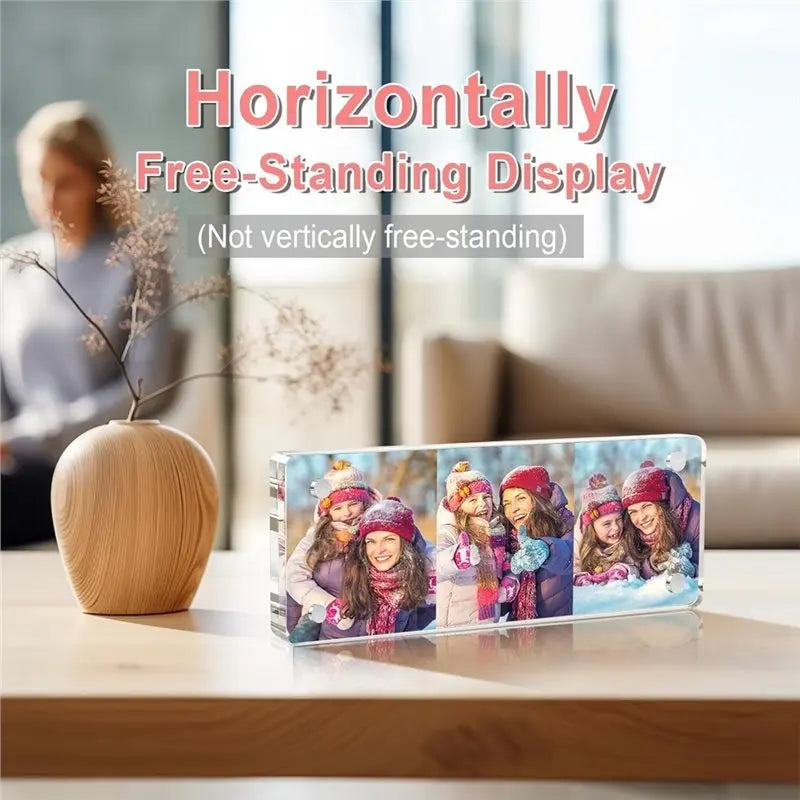 A horizontally free-standing display of a clear acrylic photo frame set featuring multiple women in winter attire.
