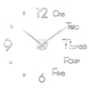 A modern 3D acrylic wall clock showing the numbers 12, 1, 2, and 3, with the hour hand pointing to 3 o'clock.