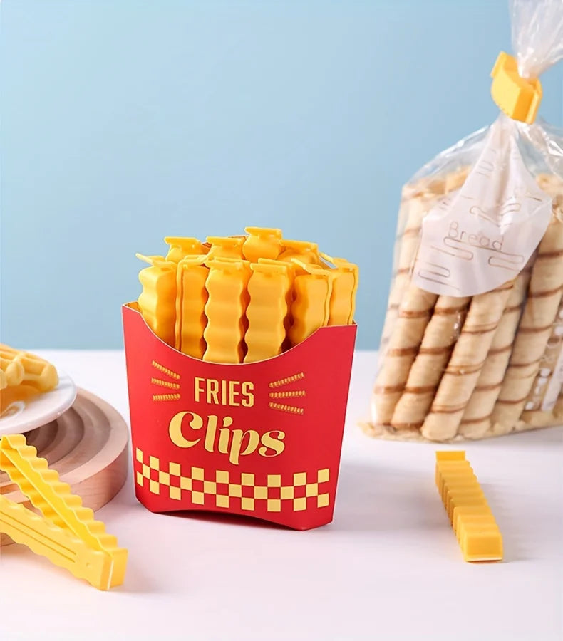 A red container of yellow french fry shaped sealing clips is shown next to a bundle of similar clips.