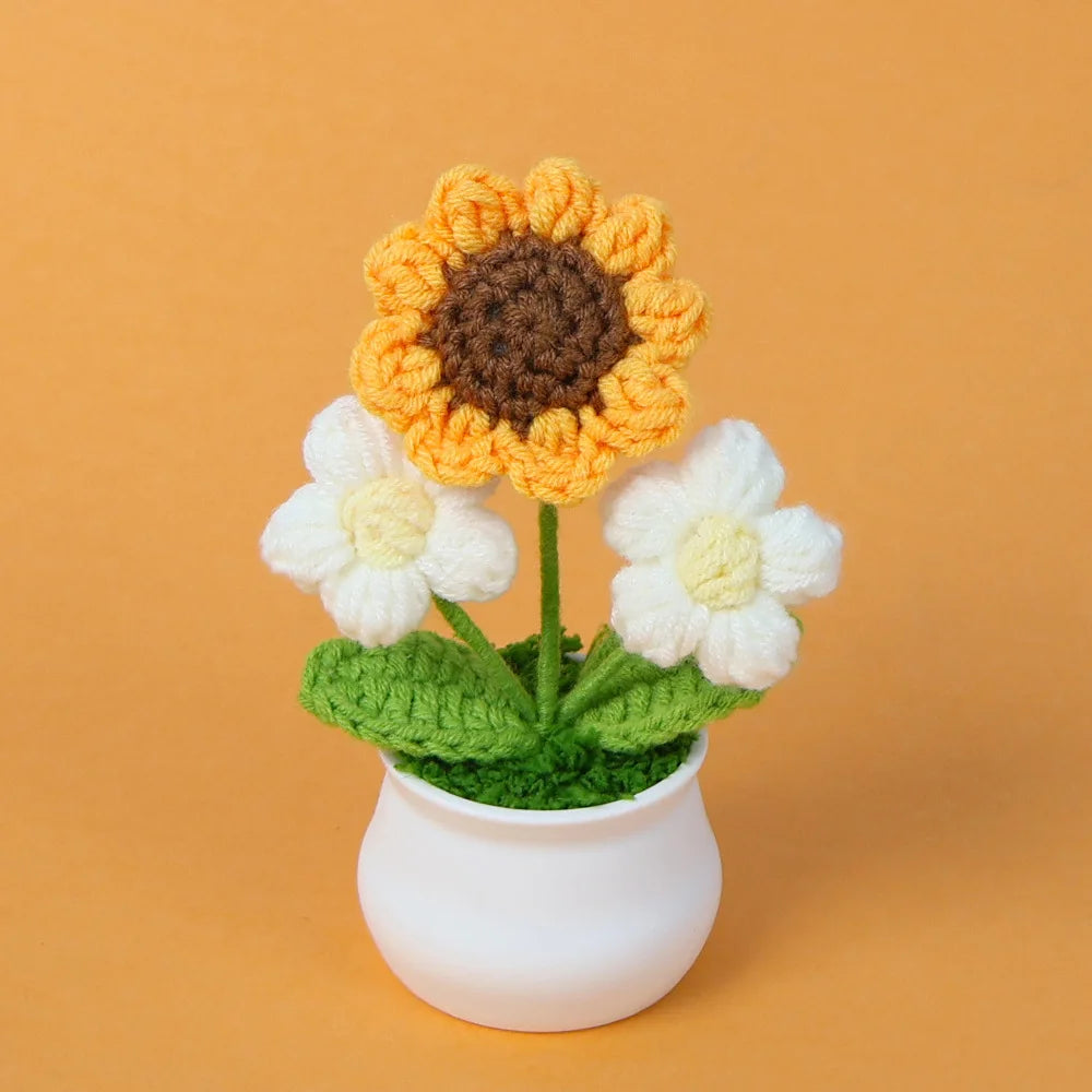Hand woven crochet sunflower and white flowers in a green pot