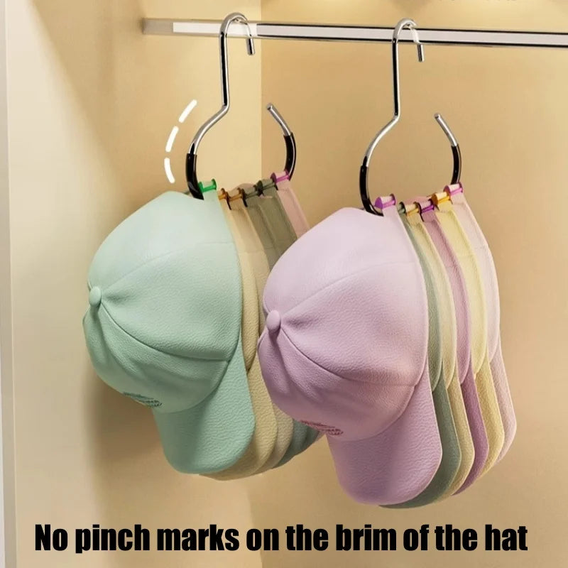 A display of various colored hats hanging on a metal rack.
