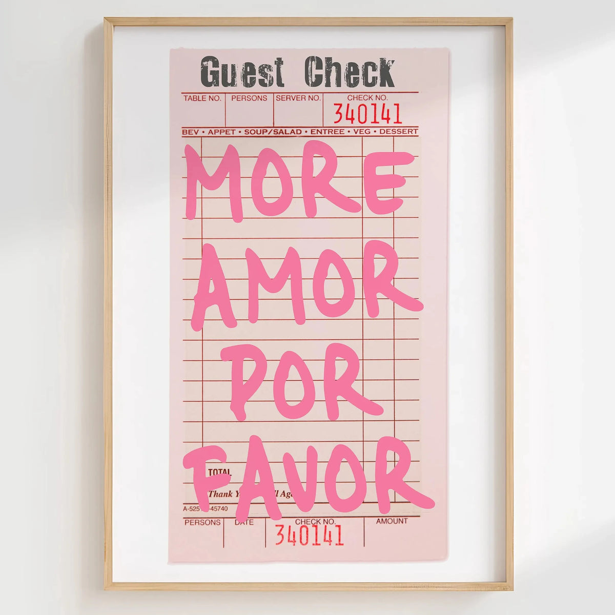 A framed print featuring a pink guest check with the text MORE AMOR POR FAVOR on it.